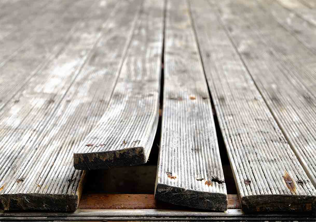 Close-up of deck boards showing repair work